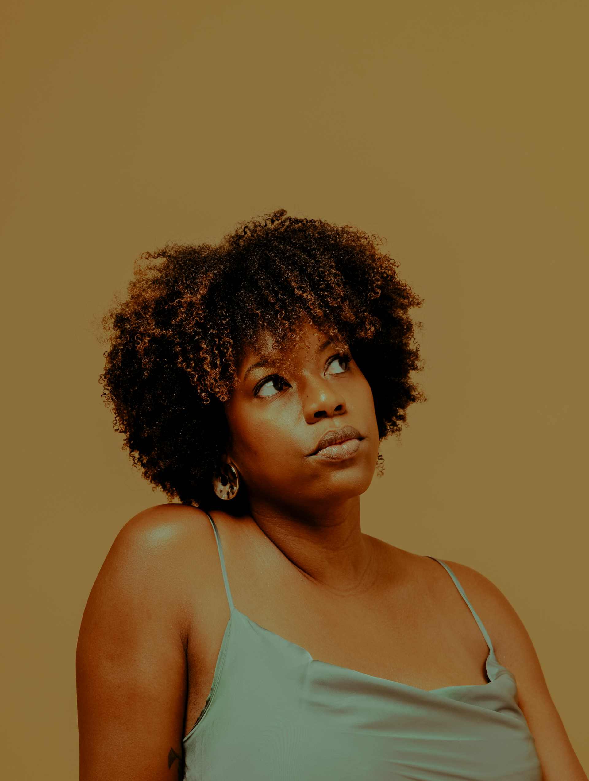 Portrait of Tomi A., founder of Tuft & Thread, in the studio